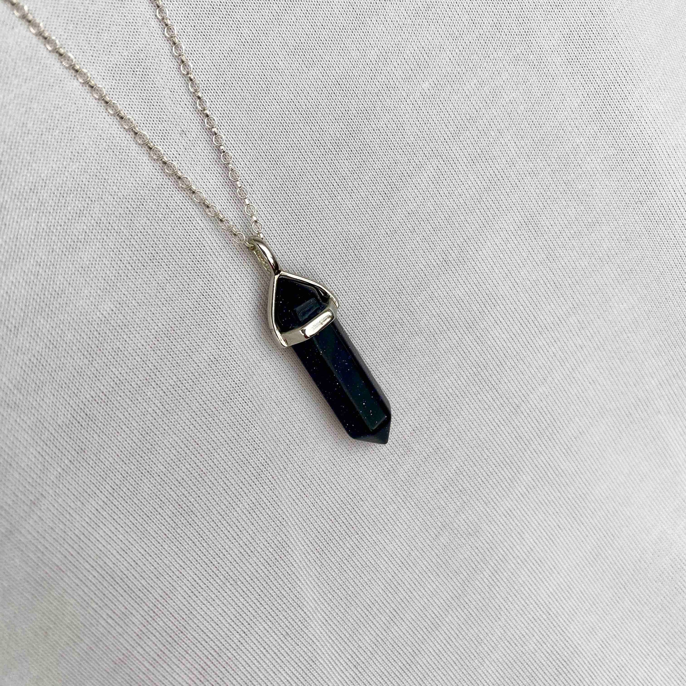 Navy blue necklace with gemstone point pendant on silver chain. KookyTwo