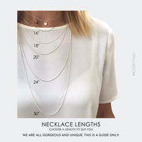 Model wearing different chain lengths as necklace is handmade and available at different lengths.