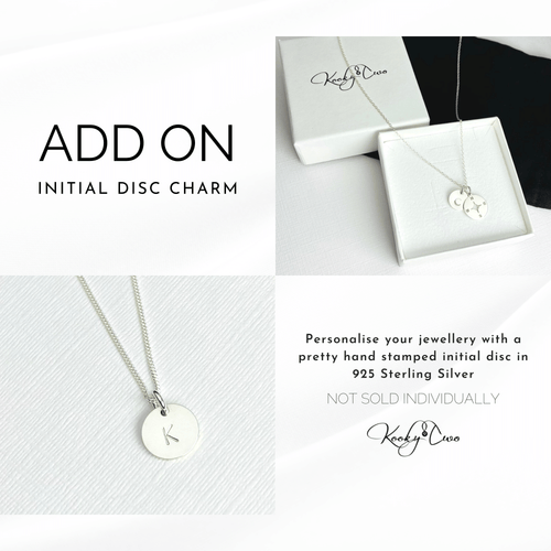 Sterling silver hand-stamped initial disc charm to be added to a necklace or bracelet. Choose a letter of your choice to be stamped on sterling silver disc.