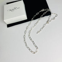 Versatile sterling silver necklace that can be adjusted using the clasp. Sterling silver necklace with wide links and paperclip style.