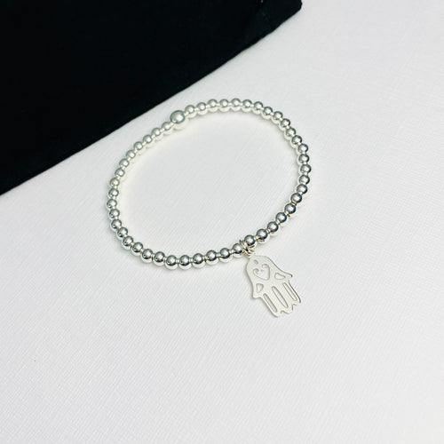 Sterling silver bead bracelet with hamsa hand pendant. Stacking bracelet to go with other silver bracelets.