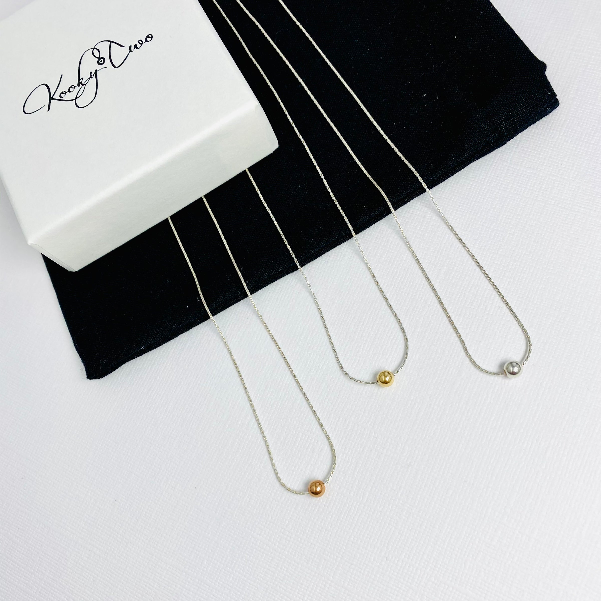 Silver necklaces with a singular bead, available in rose gold, gold and silver. Kooky Two.