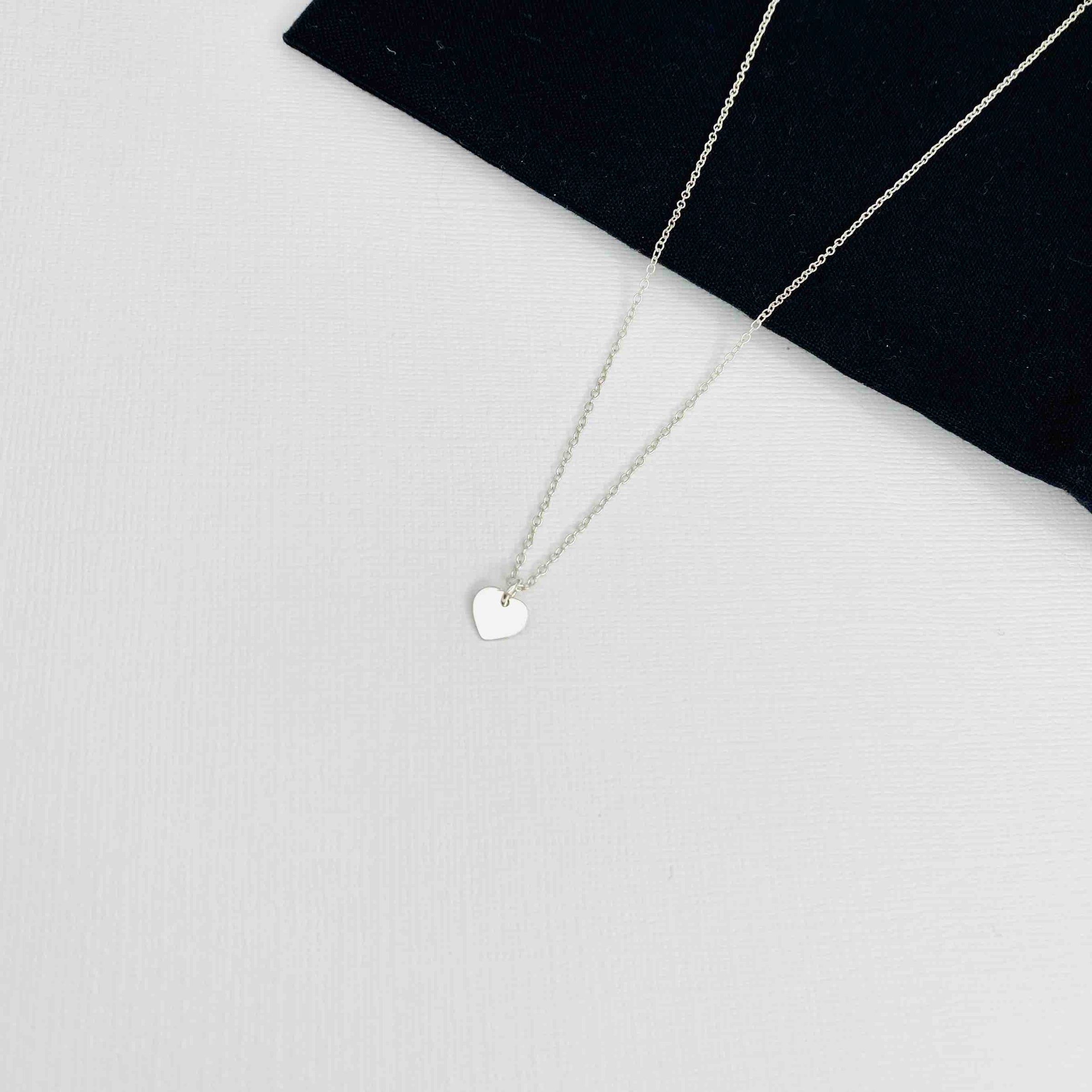 Silver heart charm necklace.