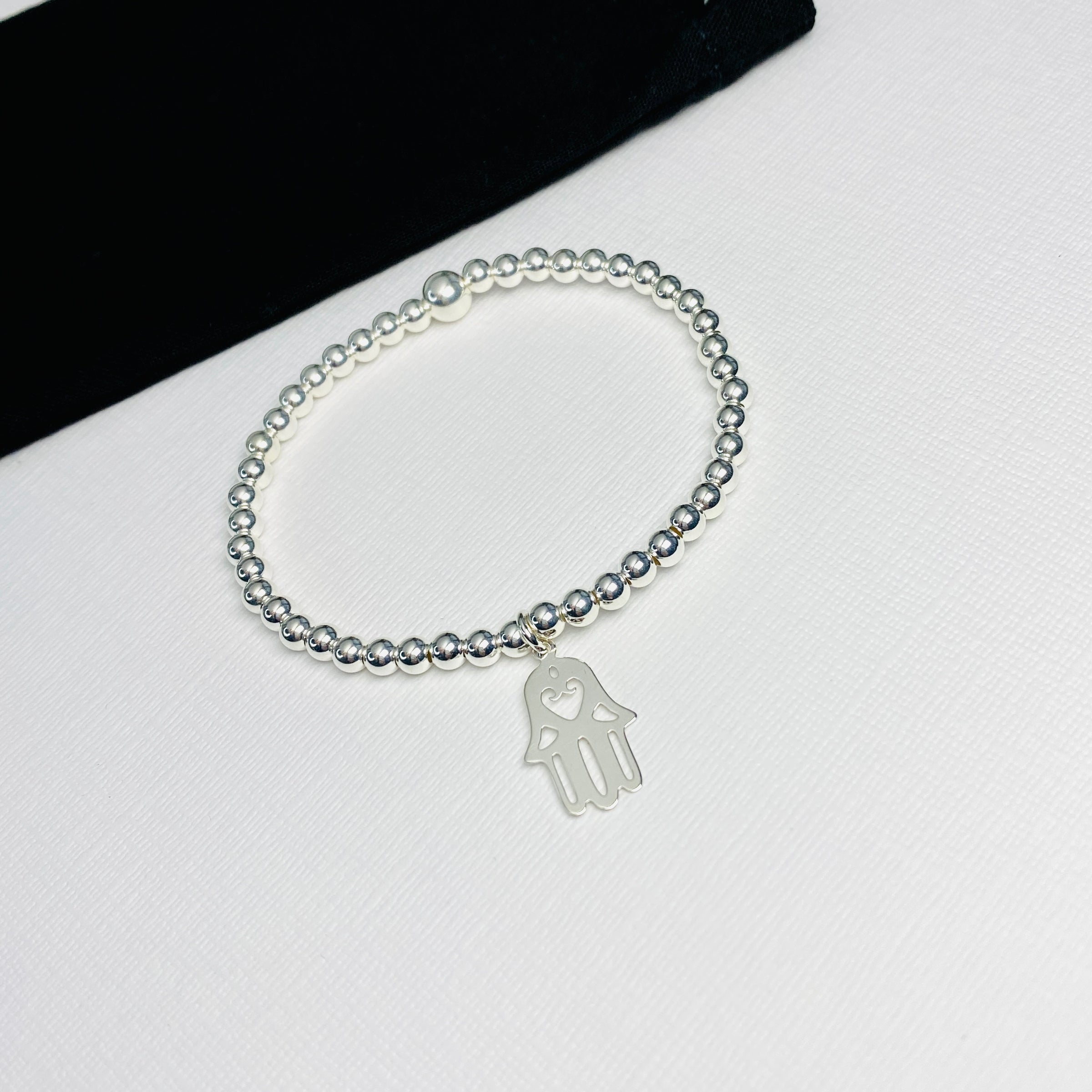 Pretty hand of Fatima charm bracelet in sterling silver.