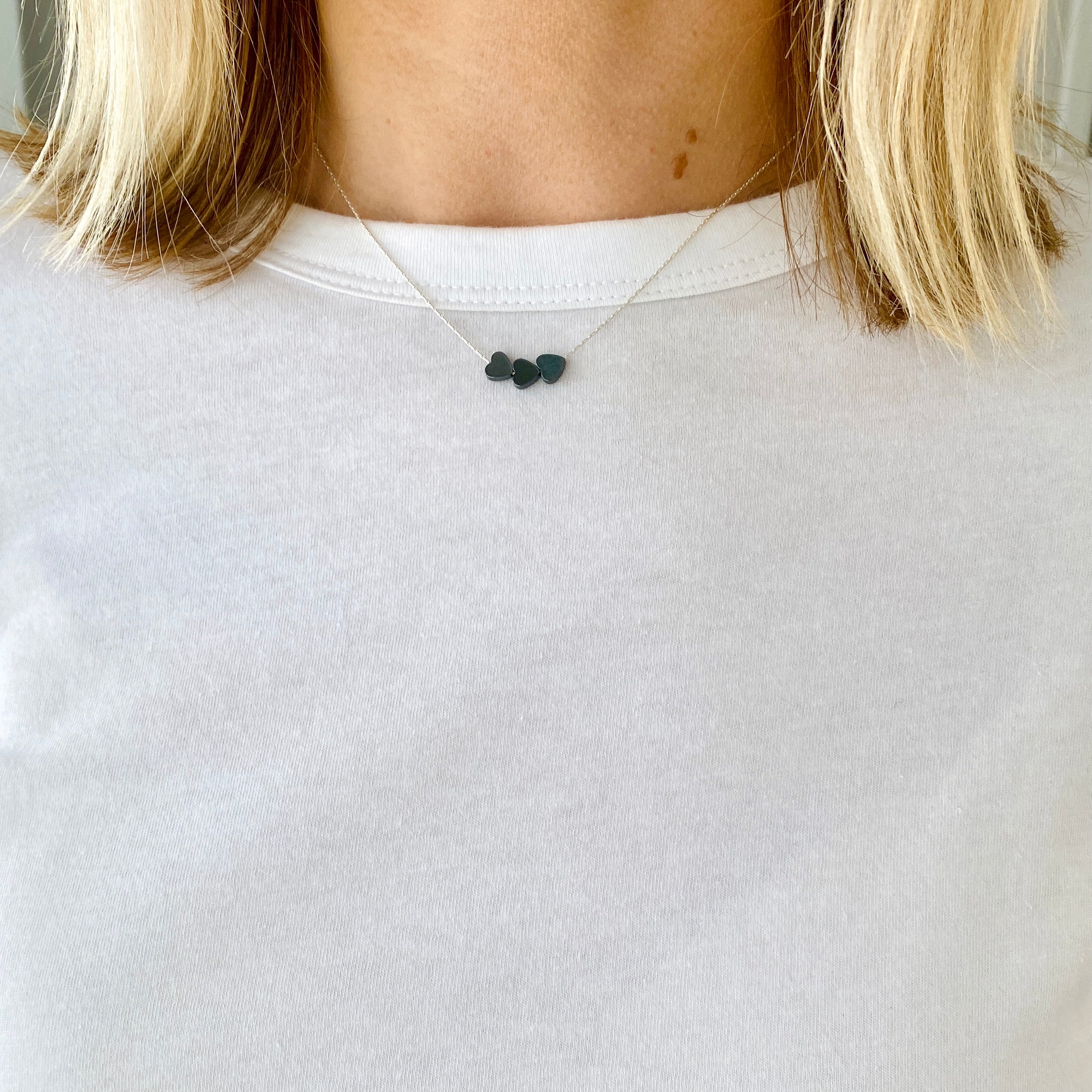 Three bead heart necklace with hematite beads moving freely on a sterling silver chain. Kooky Two.