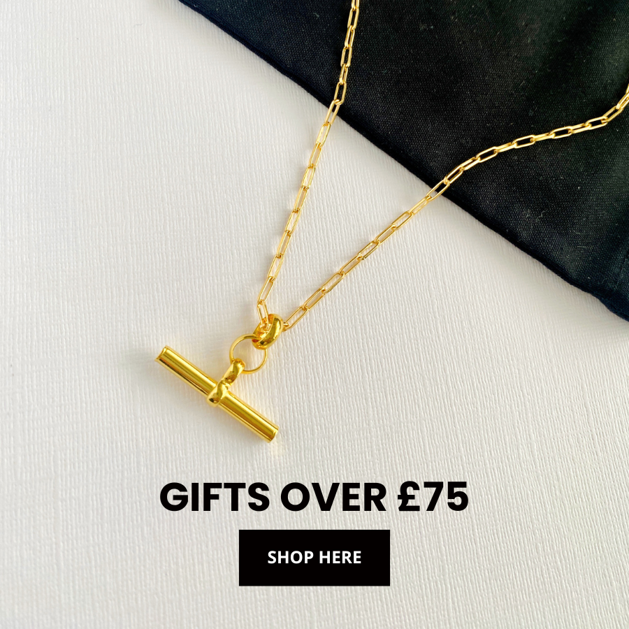 Picture of jewellery gift set with three necklaces, including an initial necklace, paperclip chain necklace and silver star necklace all presented in a gift box for Christmas.