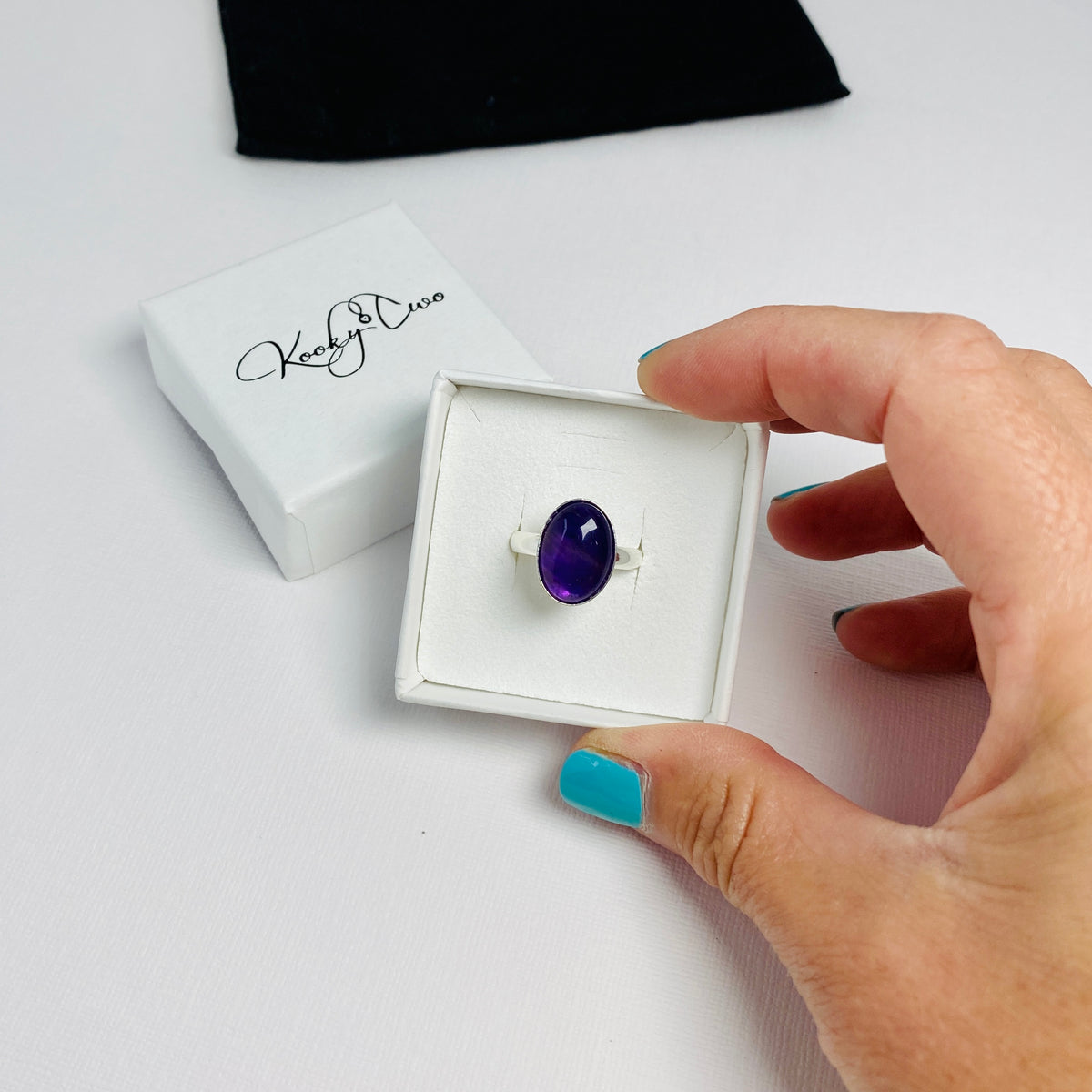 Adjsutabe rings and stacking rings. Gemstone ring with amethyst gemstone for February birthday.