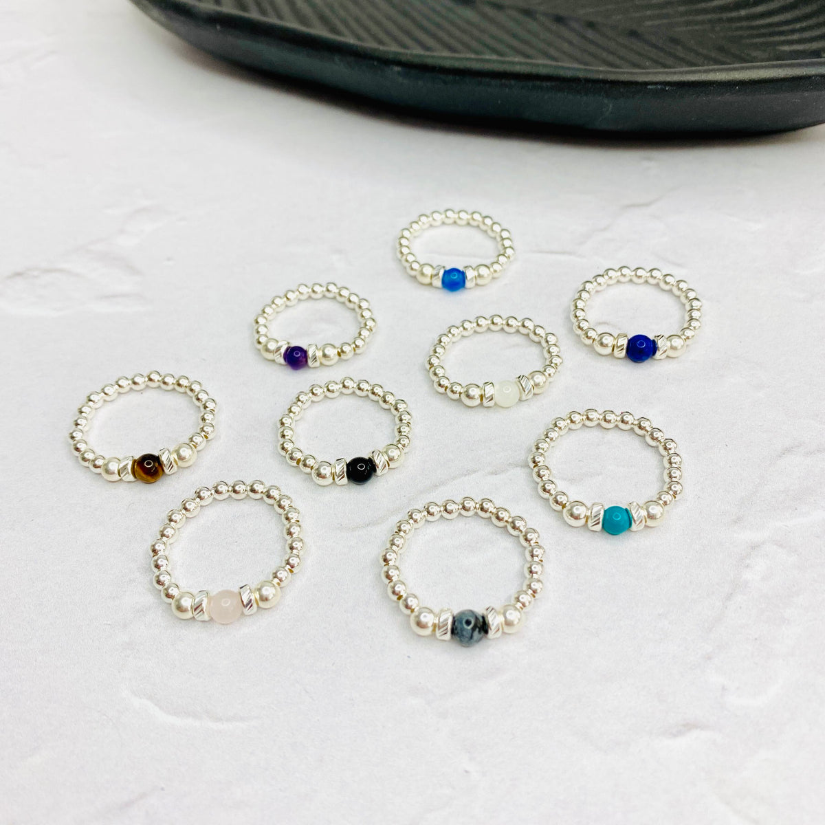 Sterling silver bead rings with colourful gemstones. Hand beaded rings on stretch elastic.