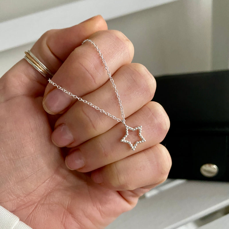 Minimalist star necklace with a delicate chain, perfect for everyday wear or gifting. KookyTwo.