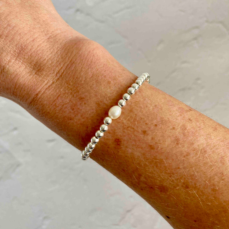 Hand beaded silver bracelet with pearl bead. Great as a stacking bracelet. KookyTwo.