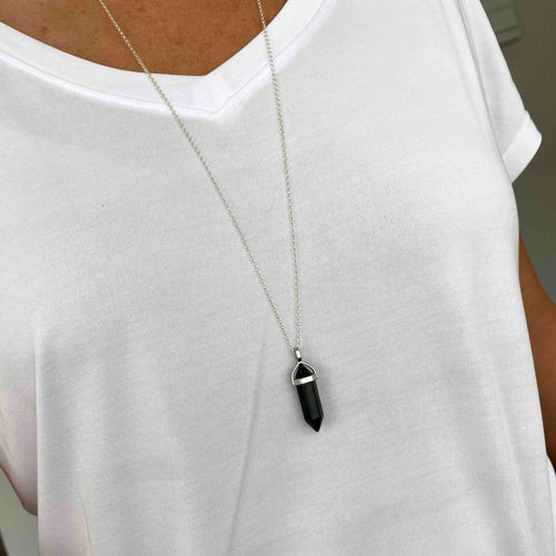 Long necklace with black onyx point pendant on silver chain for a boho look. KookyTwo.