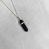 Navy blue necklace with gemstone point pendant on silver chain. KookyTwo 