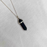 Navy blue necklace with gemstone point pendant on silver chain. KookyTwo 