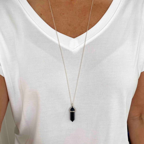 Long necklace with blue point pendant made with the gemstone blue goldstone. KookyTwo.