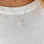 Minimalist sterling silver cross pendant necklace on sterling silver chain. KookyTwo