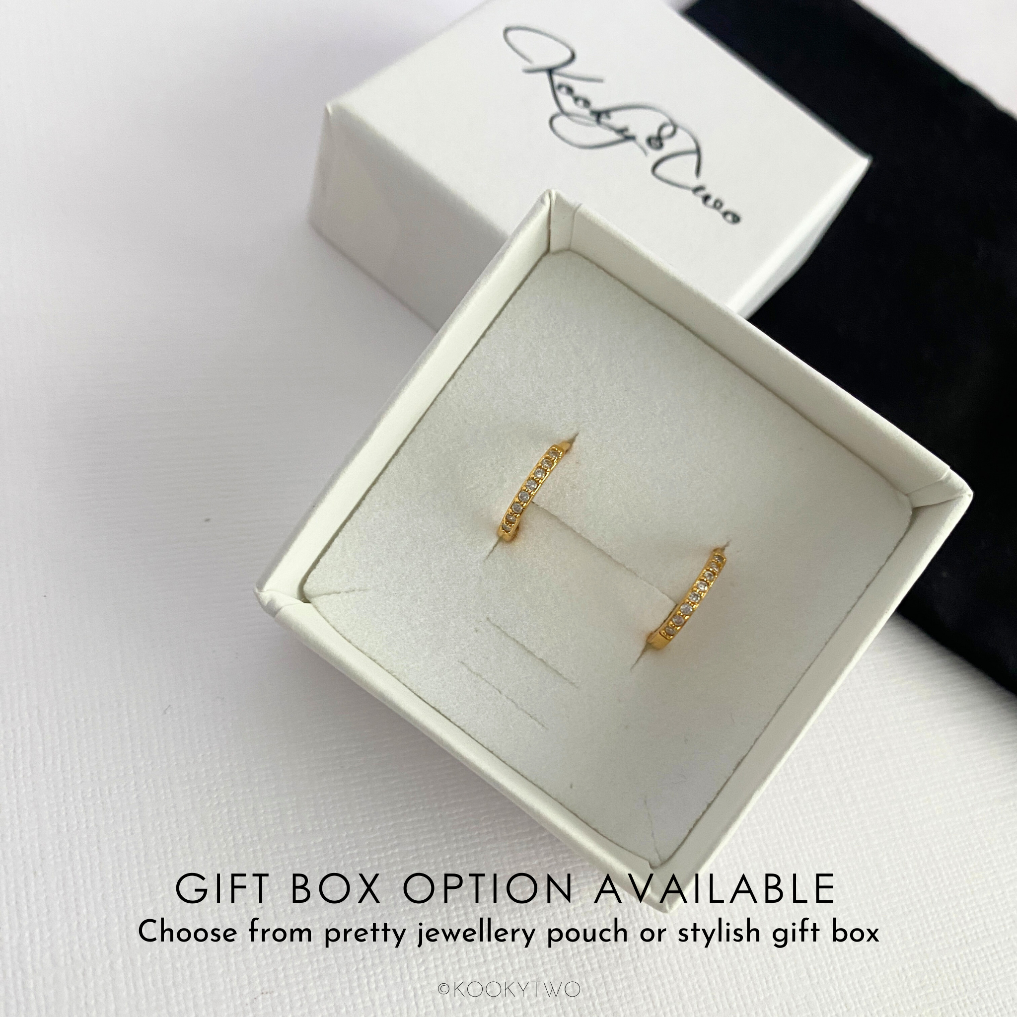 Crystal gold hoop earrings in a white jewellery box with 'KookyTwo' branding.