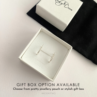 Sparkly hoop earrings in gift box with KookyTwo branding.