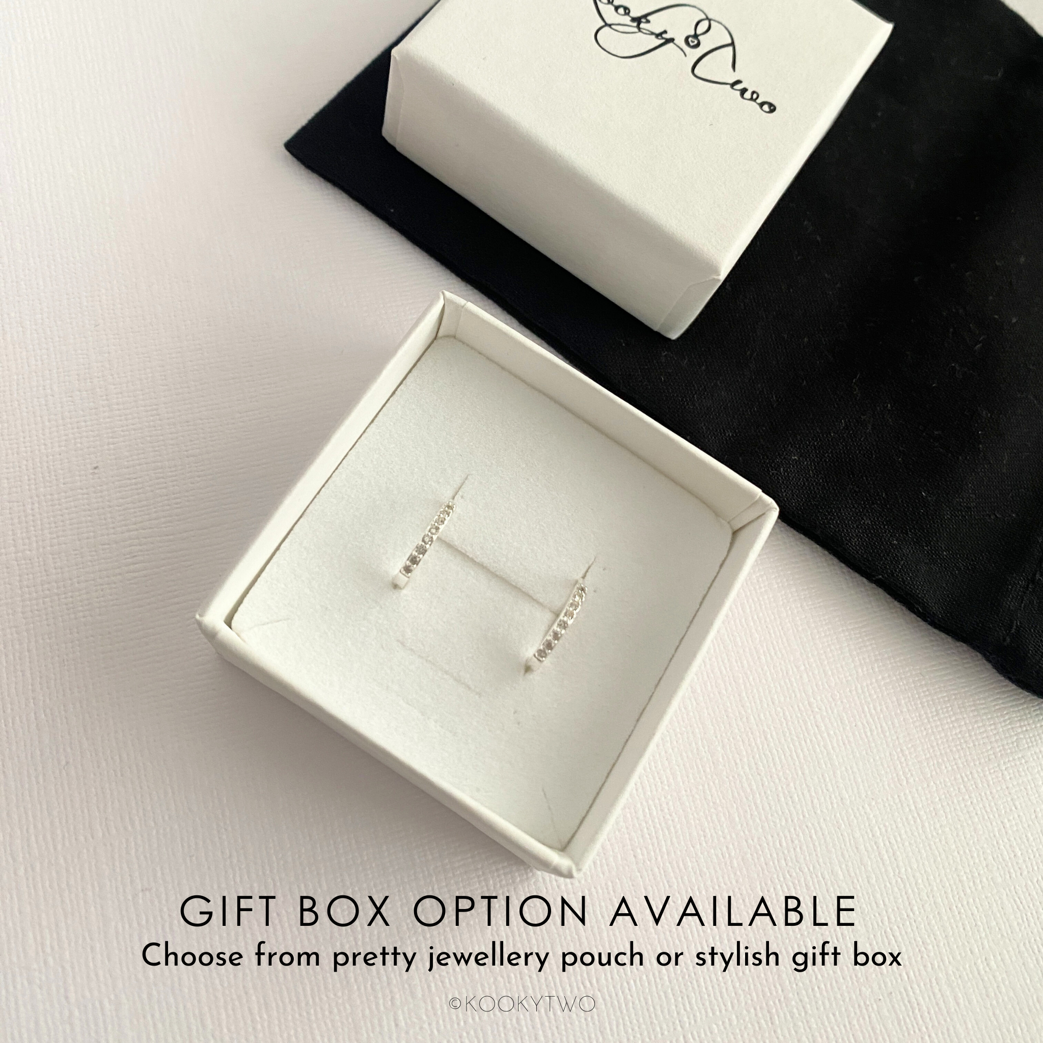 Sparkly hoop earrings in gift box with KookyTwo branding.