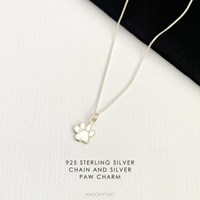 925 Sterling Silver necklace with paw charm on a white background.