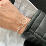 silver eternity bracelet with two circles interlocked to represent mother and daughter. KookyTwo.