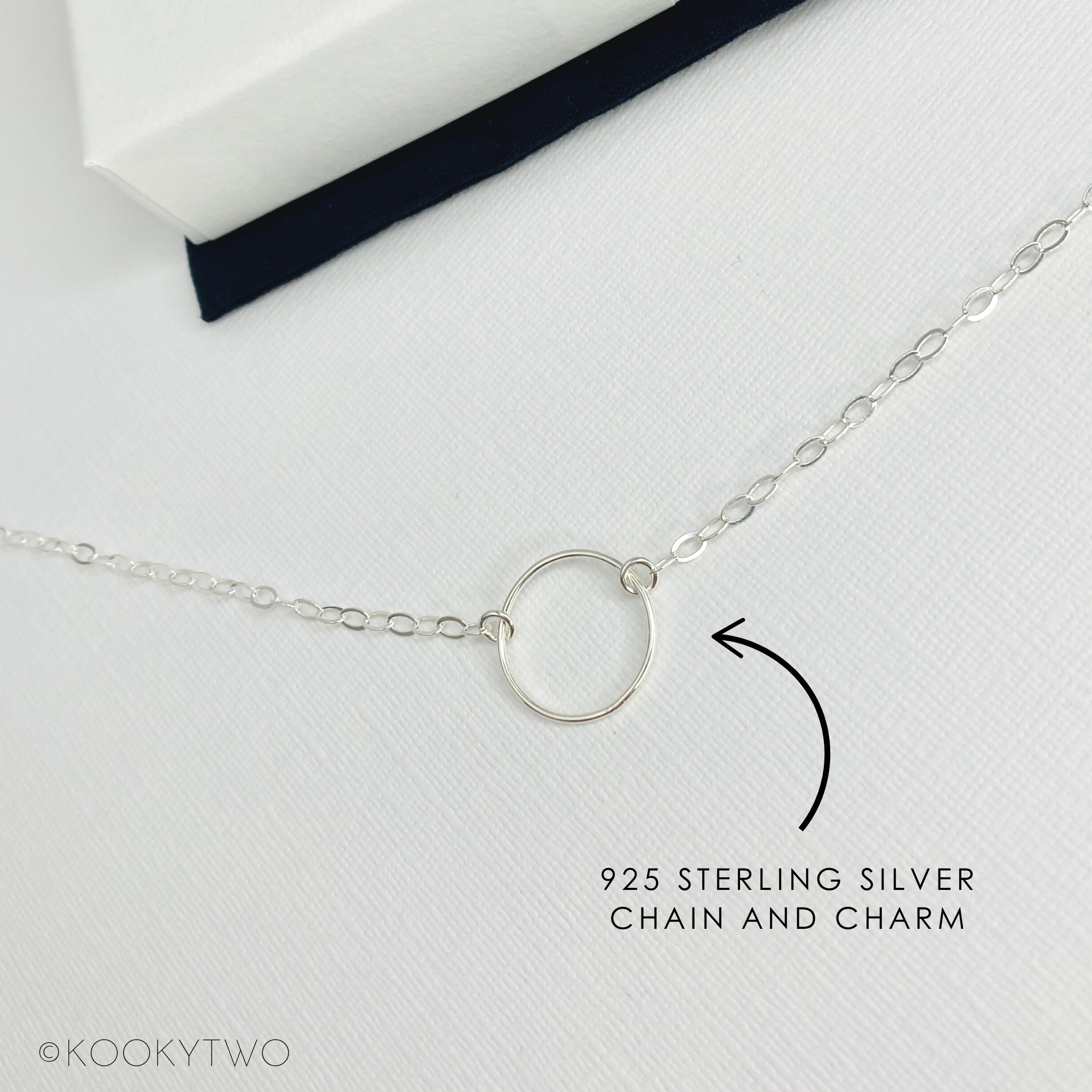 Silver eternity necklace with a circular charm on a white background, labeled '925 Sterling Silver Chain and Charm' by KOOKYTWO.