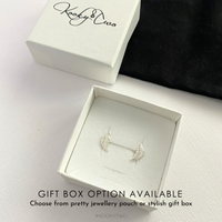Silver earrings in a stylish gift box with 'KookyTwo' branding.