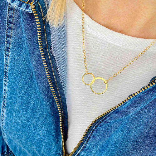 Gold necklace with two interlocked rings on 14k gold filled chain. Perfect gift for sisters or mother and daughter. KookyTwo.
