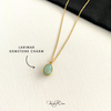 Larimar gemstone charm necklace on a white background with KookyTwo branding.