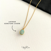 Larimar gemstone charm necklace on a white background with KookyTwo branding.