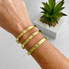 Summer jewellery styling with gold cuff bangle featuring three bars with a hammered effect. KookyTWo