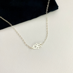 Silver necklace with hand of Fatima charm in sterling silver. KookyTwo.