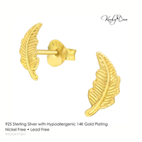 Hypoallergenic gold feather stud earrings on a white background with KookyTwo branding.