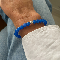 A stunning blue onyx bracelet adorning a wrist, the perfect accessory for everyday wear.