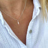 Sterling silver necklace with lightning bolt charm. Everyday necklace with a minimalist look.