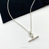 Close-up of sterling silver hanging bar necklace, showcasing the high-quality materials and contemporary design. KookyTwo.