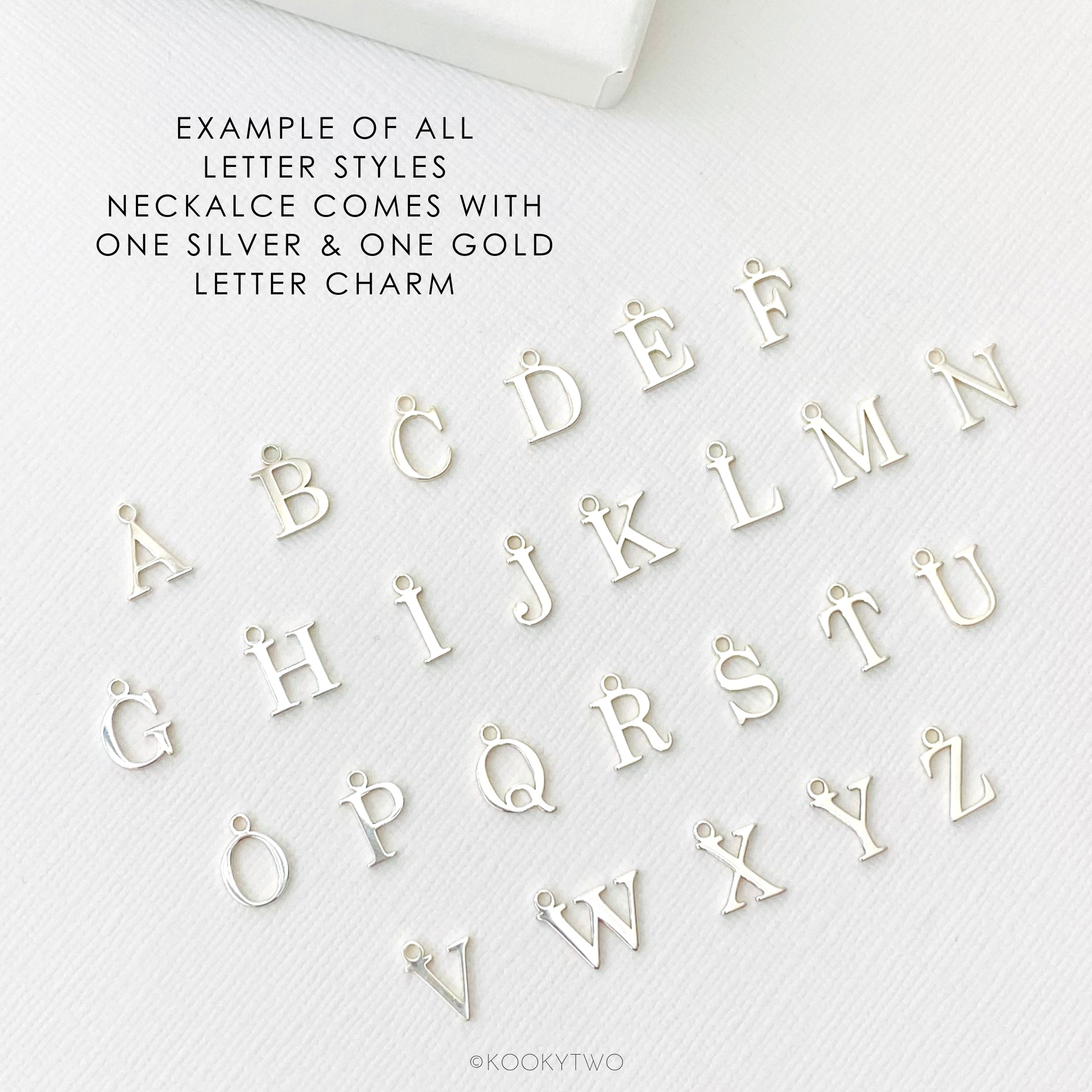 Silver letter charms on a white background with text about monogram styles.