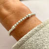 Everyday silver bead bracelet with etched silver beads on strong stretch elastic. KookyTwo.