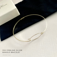 925 Sterling Silver Bangle Bracelet on a neutral background. KookyTwo.