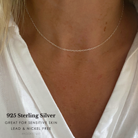 Lady wearing fine silver necklace in 925 sterling silver with white shirt. Words say great for sensitive skin and lead and nickel free. @kookytwo