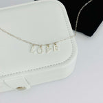 Silver love necklace with letter charms. KookyTwo.