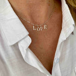 Silver necklace with love word. KookyTwo.