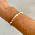 Sterling silver bead bracelet with single freshwater pearl. KookyTwo.