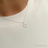 Sterling silver star necklace with a delicate chain, a perfect gift for birthdays or special occasions. KookyTwo.