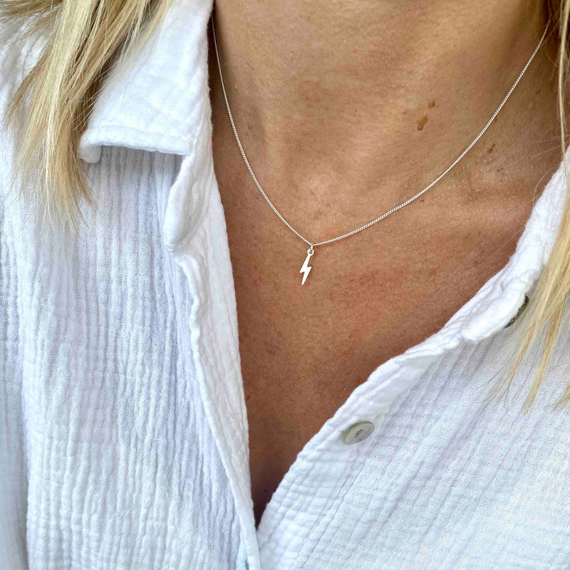 Everyday necklace featuring mini lightning bolt charm in sterling silver. KookyTwo handmade jewellery for everyday wear.
