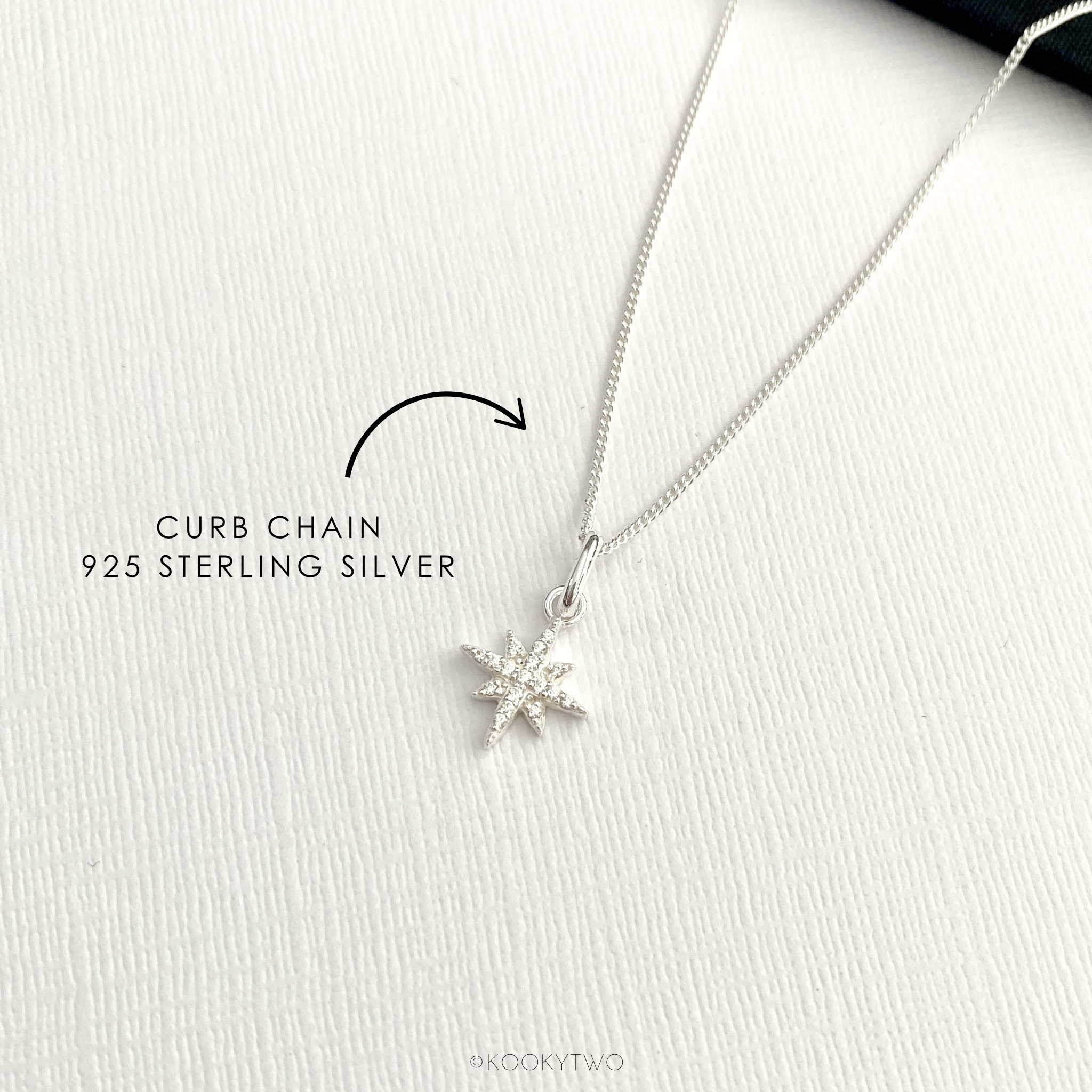 Sterling silver star necklace with a crystal star pendant on a white background, labeled as curb chain 925 sterling silver.