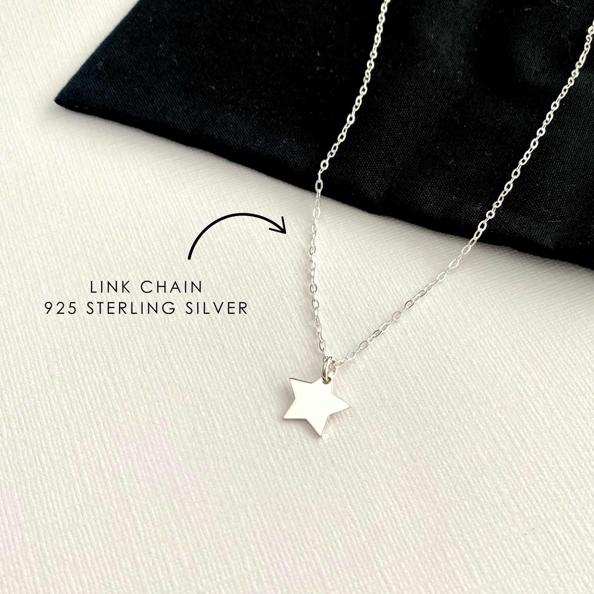 Sterling silver star necklace on a black and white background with text indicating 'Link Chain 925 Sterling Silver'.