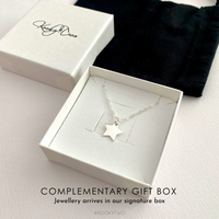 Silver star necklace in a white gift box with 'KookyTwo' branding.