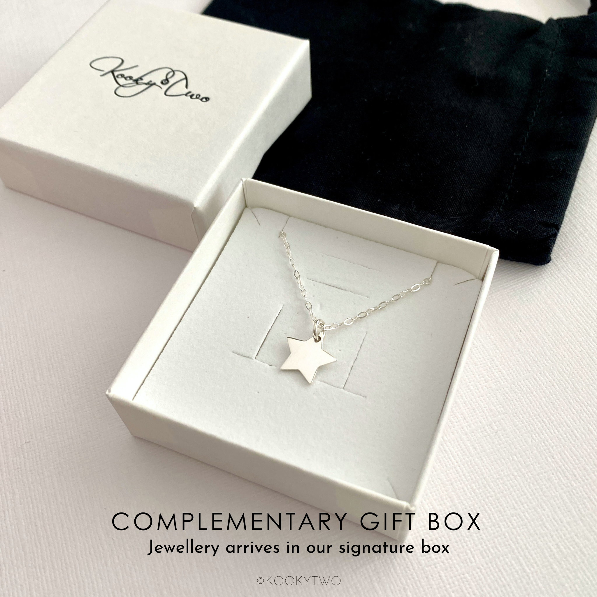 Silver star necklace in a white gift box with 'KookyTwo' branding.