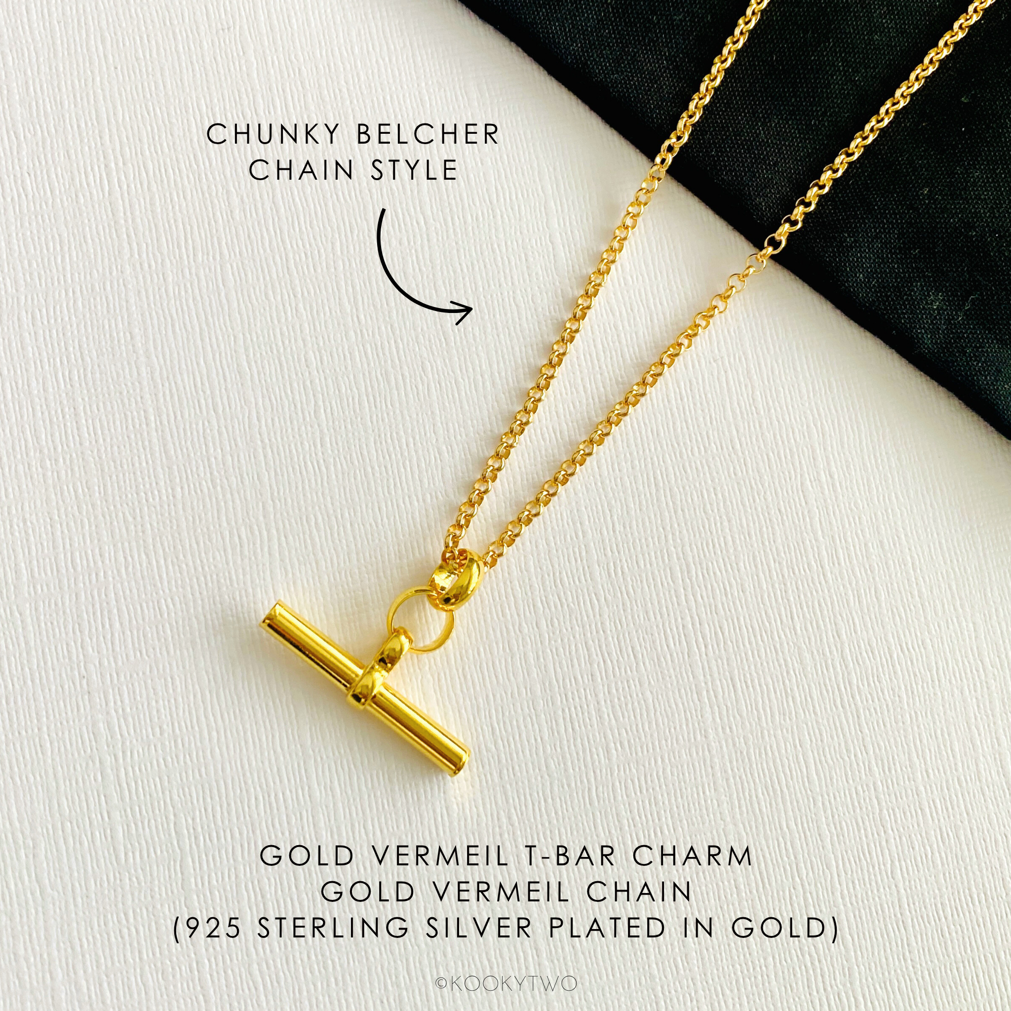 Gold vermeil T-bar charm necklace on a white background.