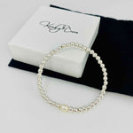 Bridal bracelet with sterling silver beads and single pearl bead. KookyTwo.